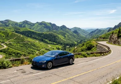 Best electric vehicles of 2026 parked on a scenic mountain road on a sunny day