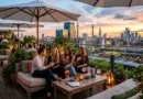 Skylark Roof Garden London — rooftop bar with cocktails, green plants, and panoramic West London skyline at sunset